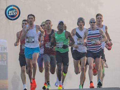 Elite marathon lead pack racing out of the fog